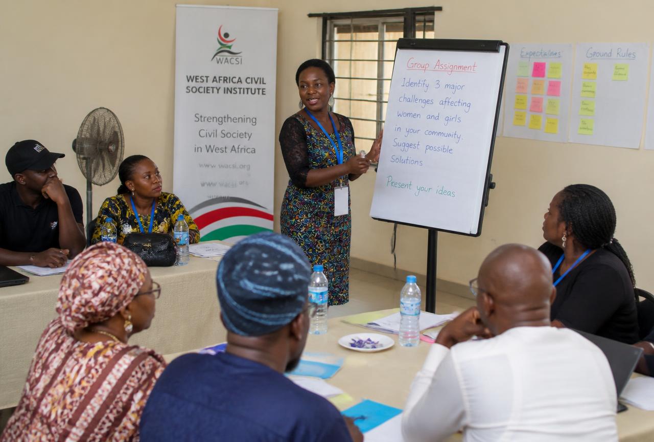 Placeholder photograph: adults taking part in a facilitated training workshop